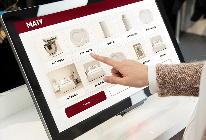 Retail touchscreen kiosk showcasing endless aisle product catalog on a durable interactive display