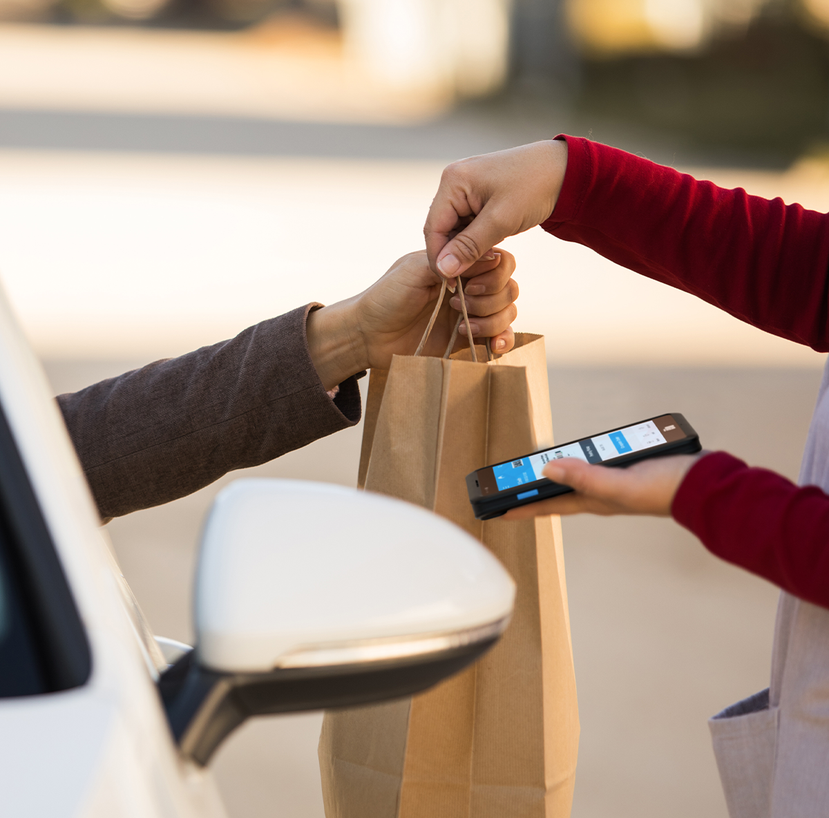 Image of mobile device for restaurant technology solutions, curbside order pickup