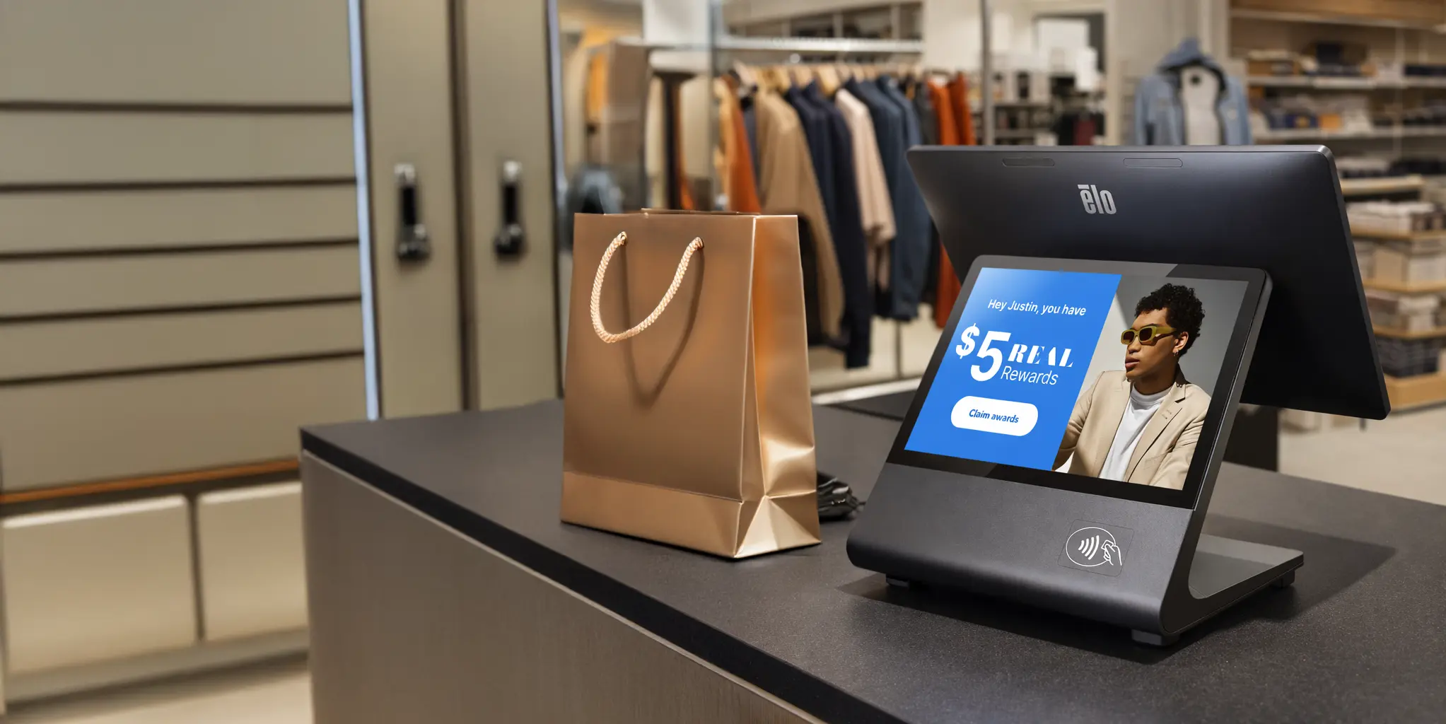 Elo dual-screen POS terminal displaying personalized retail media rewards at a store checkout counter