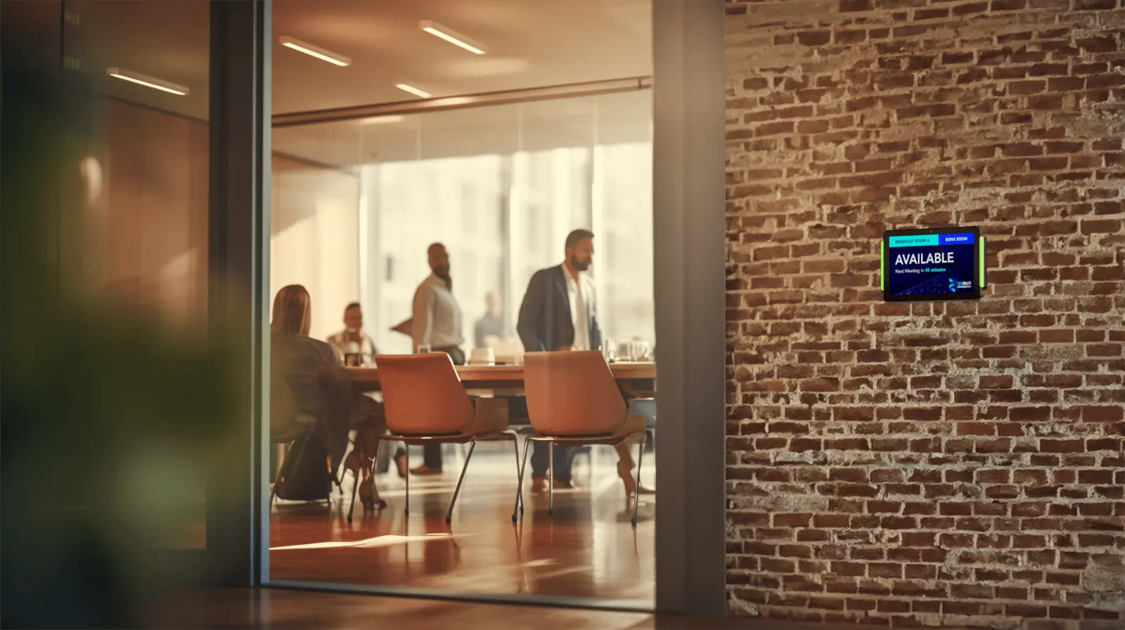 Simplify Meeting Room Scheduling Office touchscreen mounted outside of a meeting room displaying availability and other scheduling options