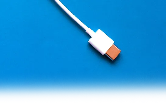 Image of a single USB-C cable cord representing streamlined power and data integration.
